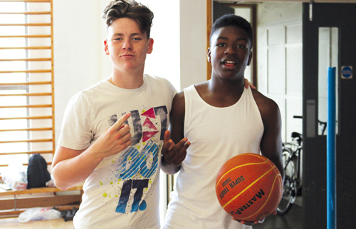 Two young people with basketball