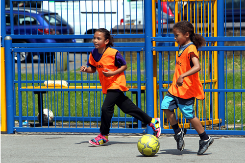 Young people playing football